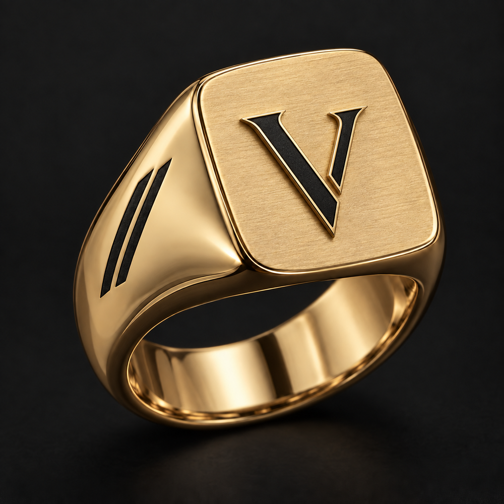 Design concept of the VEYREN split V gold signet with charcoal signature detail